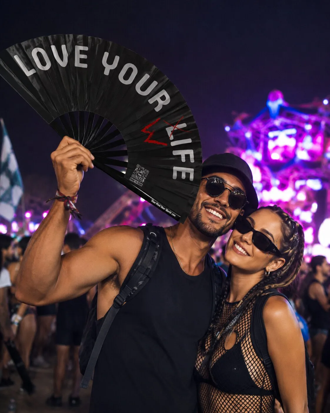 YMYW "Love Your Life" festival hand fan, 25-inch black clack fan with bold white text and a red accent mark through the L