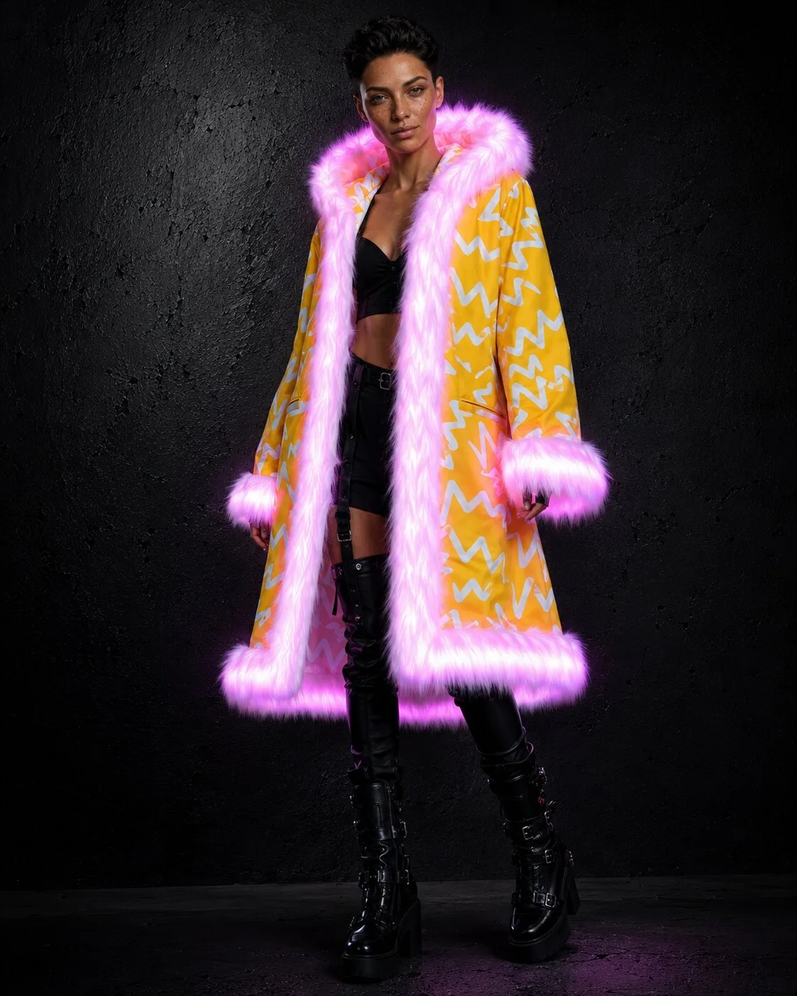 Woman in a light-up yellow and white LED fur coat glowing pink
