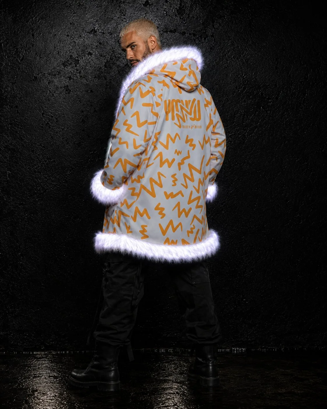 Back view of an orange and white LED fur coat glowing white