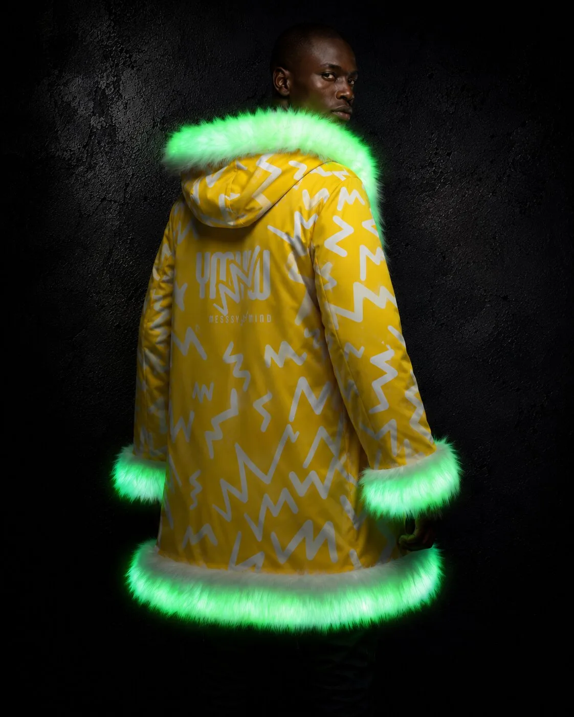 Back view of a men's yellow and white LED fur coat glowing green